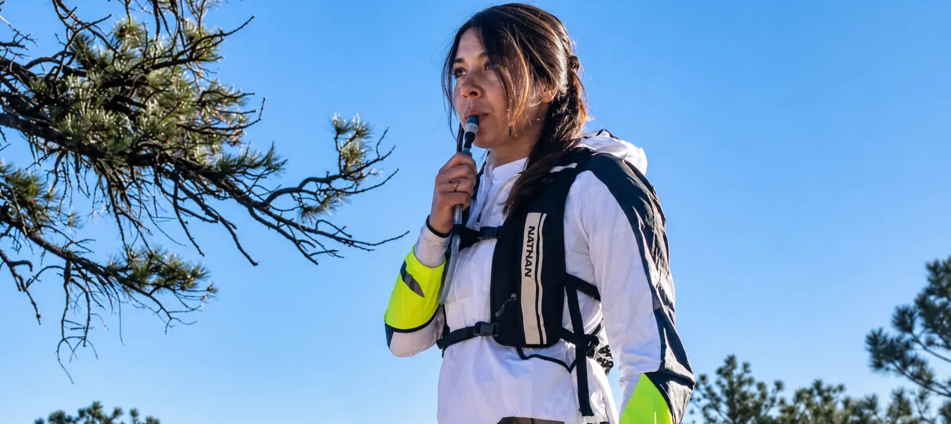 Group of trail runners racing with hydration vests