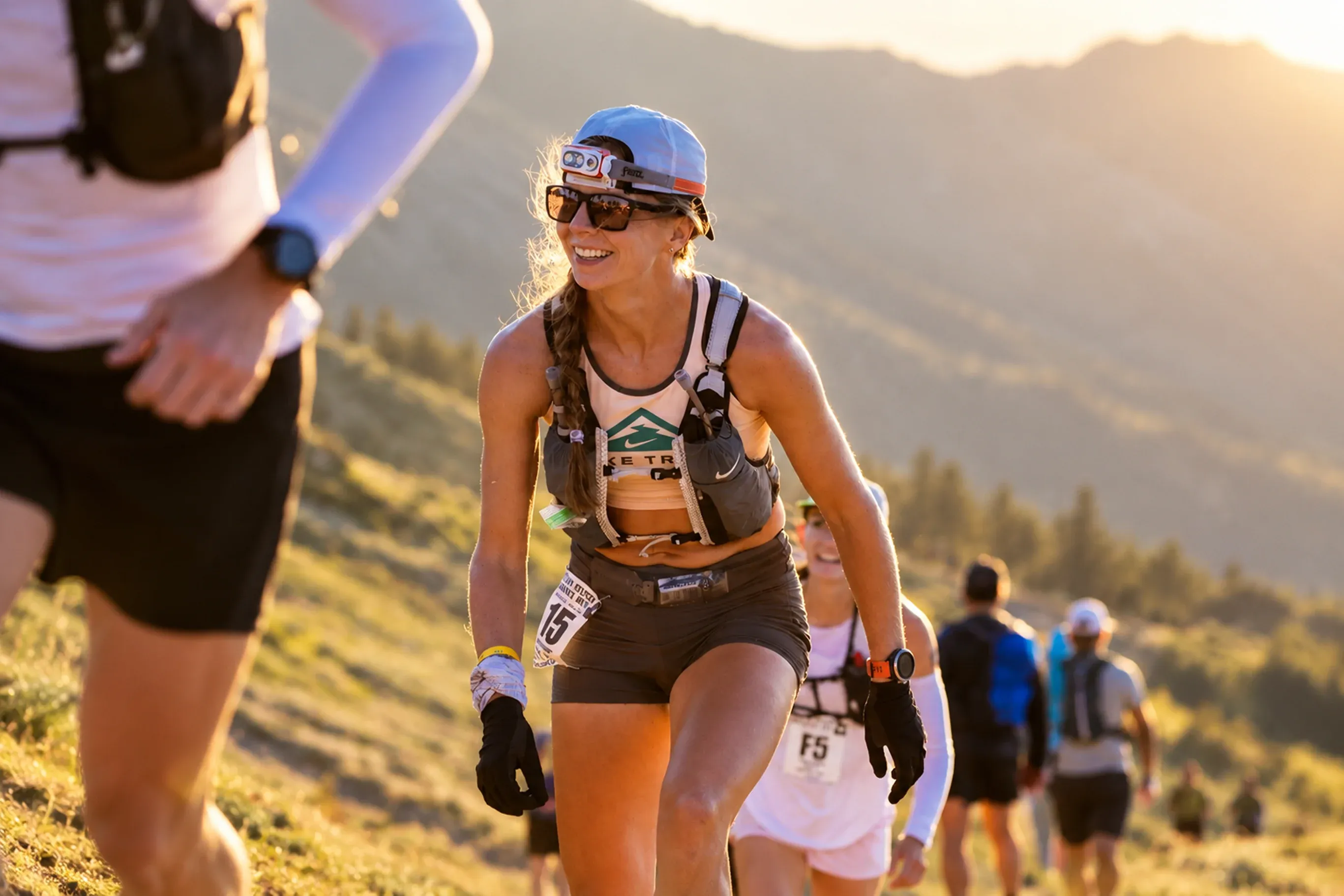 Trail runner preparing for a 50 km race on a mountain path